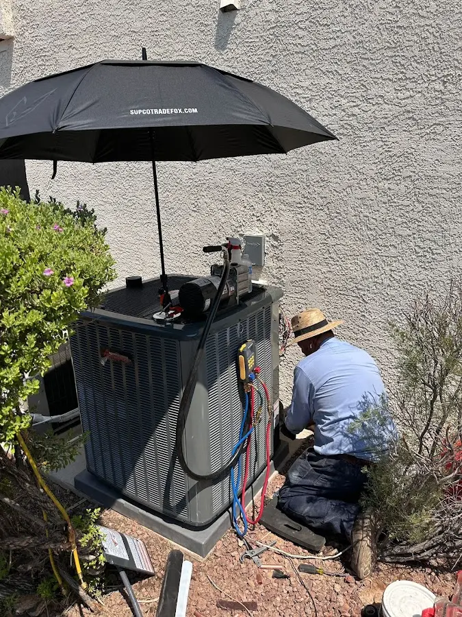 HVAC technician performing outdoor AC maintenance in South Apopka